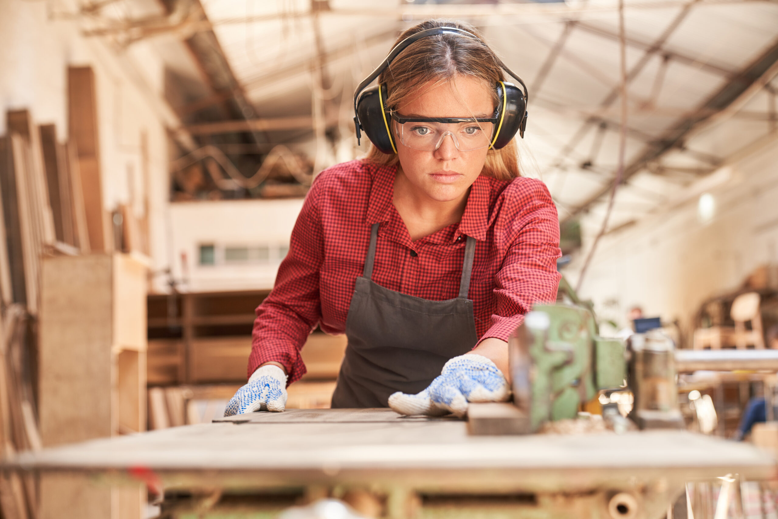 Young,Woman,As,A,Carpenter,With,Safety,Glasses,And,Hearing